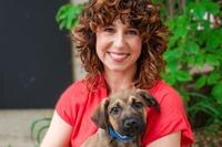 Dr. Annie Valuska, PhD holding her puppy