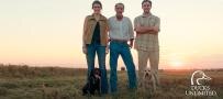 Ducks Unlimited female and two males with dog