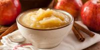 bowl of applesauce and apples on table
