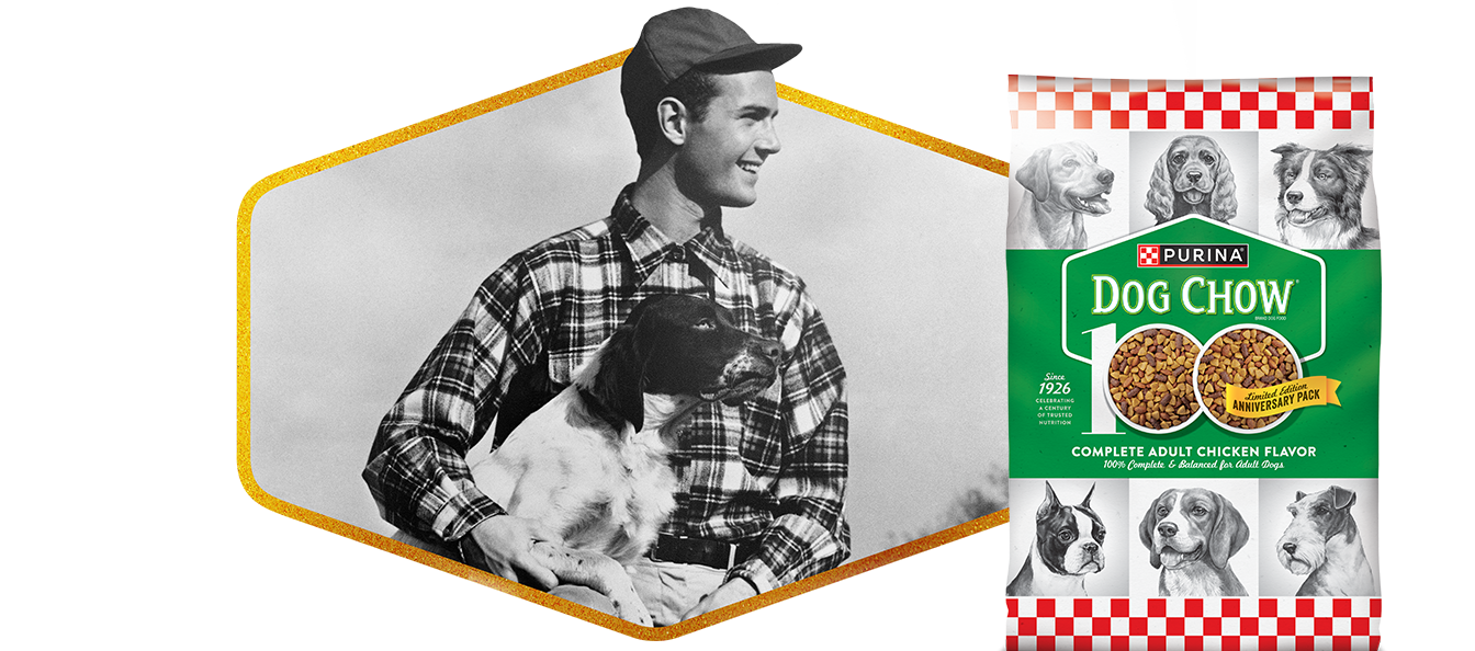 old black and white image of man holding his dog.