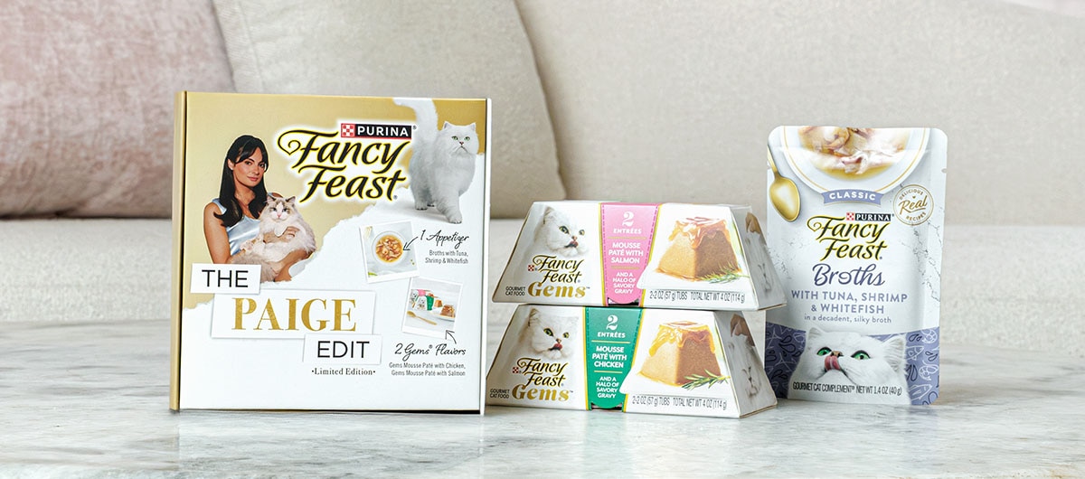 The Paige Edit box and products, featuring Fancy Feast Gems and Classic Broths.