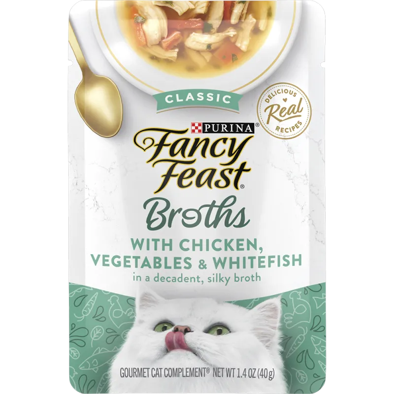 Complemento de alimento húmedo de pollo, vegetales y pescado blanco en un delicioso caldo Fancy Feast para gatos